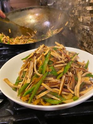  Spicy Dried Bean Curd Stir-Fried With Fragrant Chili Peppers and Silky Tofu: A Symphony of Textures for Your Palate!